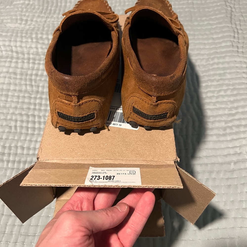 Well traveled Minnetonka Moccassins. Rough Brown. Size 10.5.